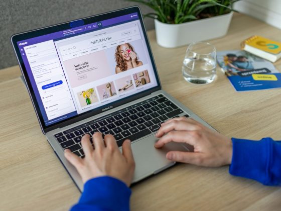 a person typing on a laptop on a table